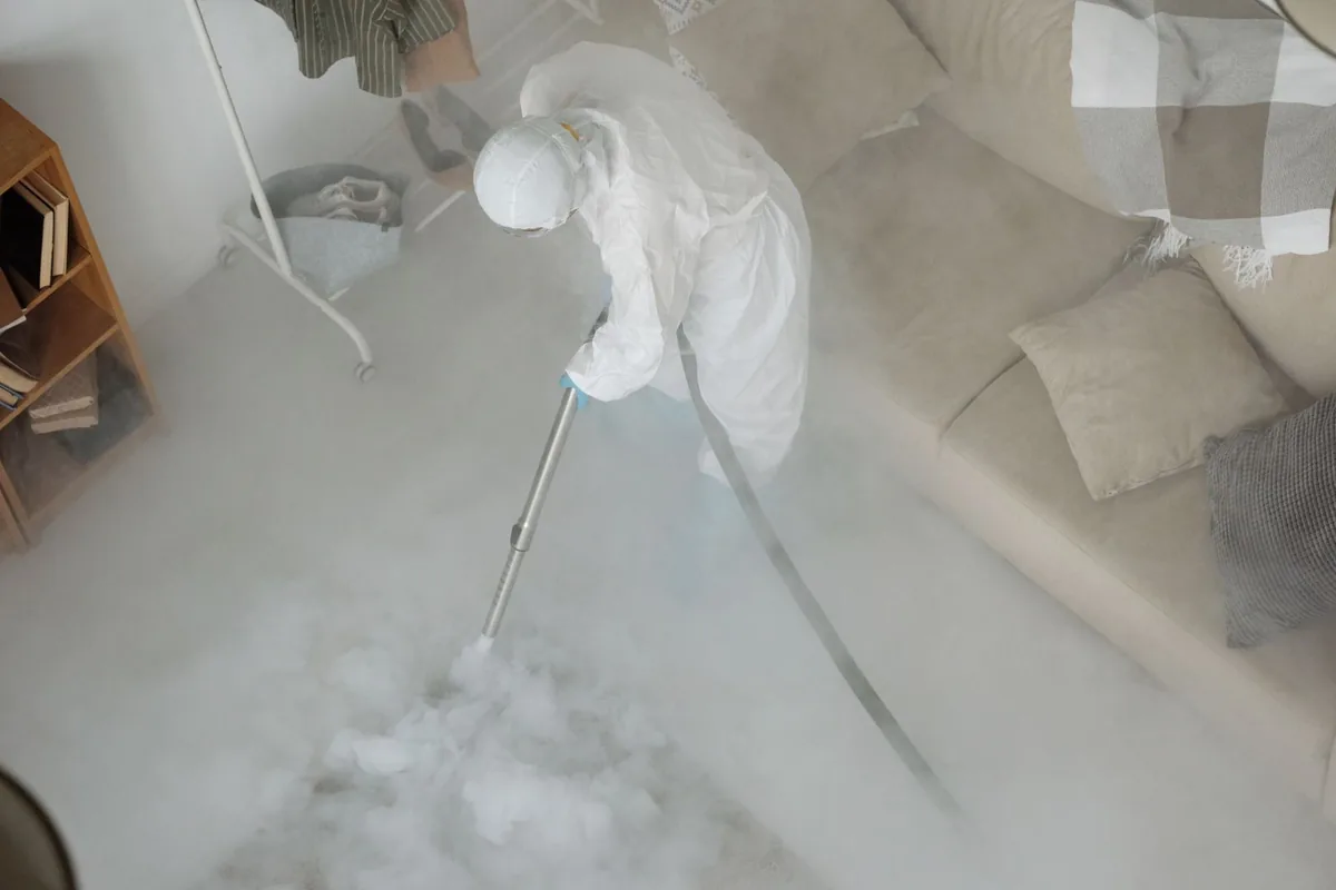 Biohazard cleanup technician in protective equipment, Ellenville, NY